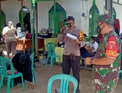 Kolaborasi Babinsa 0909-01/Sangatta dan Bhabinkamtibmas Sukses Dampingi Pelaksanaan Vaksinasi